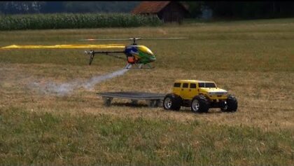 RC Hummer Yellow and Trex-600 DFC landing on a small