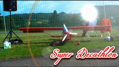 Video by RCHeliJet™ Aerobatics R/C Super Decathlon and a parachutist
